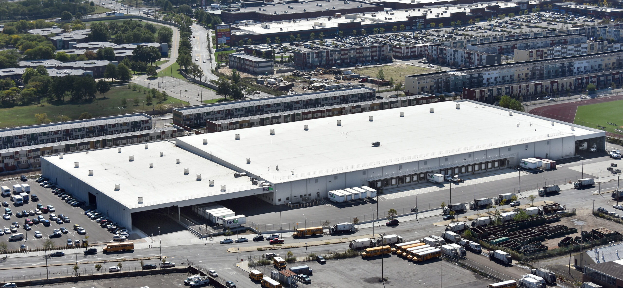 A large distribution center with many alternative uses in the foreground and background
